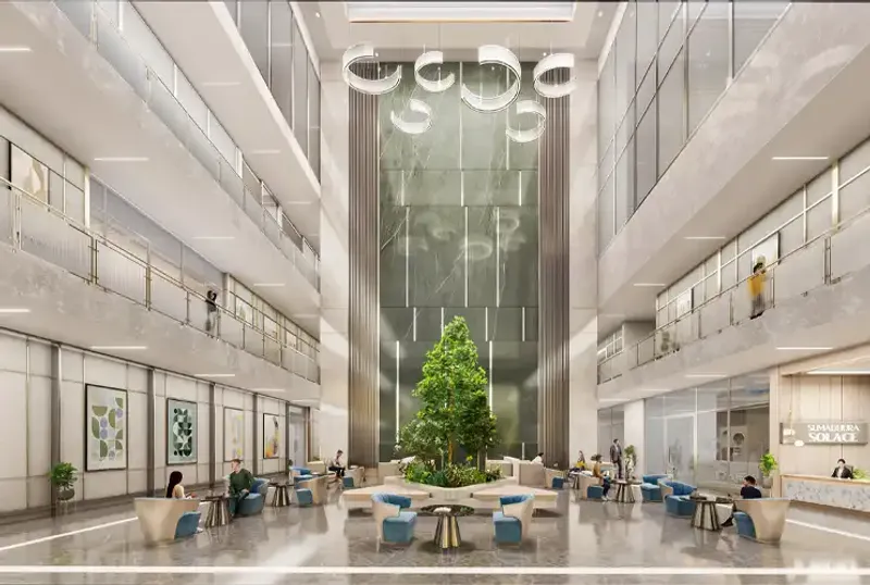 Grand double-height lobby with tree centerpiece